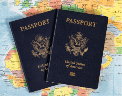 This is an image of two passports on a map